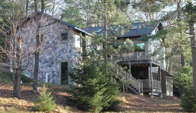 Experience serenity relaxing in this single family home on the Manitowish Chain